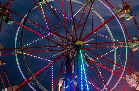 Colorful lights on the Ferris wheel at the county fair
