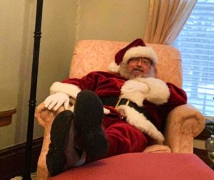 Santa relaxing with his feet up