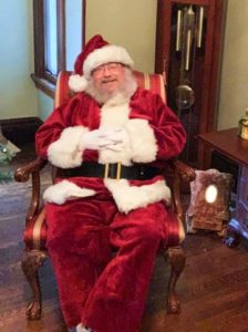 Santa sitting in an antique chair