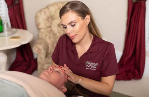 Woman giving en suite therapeutic massage