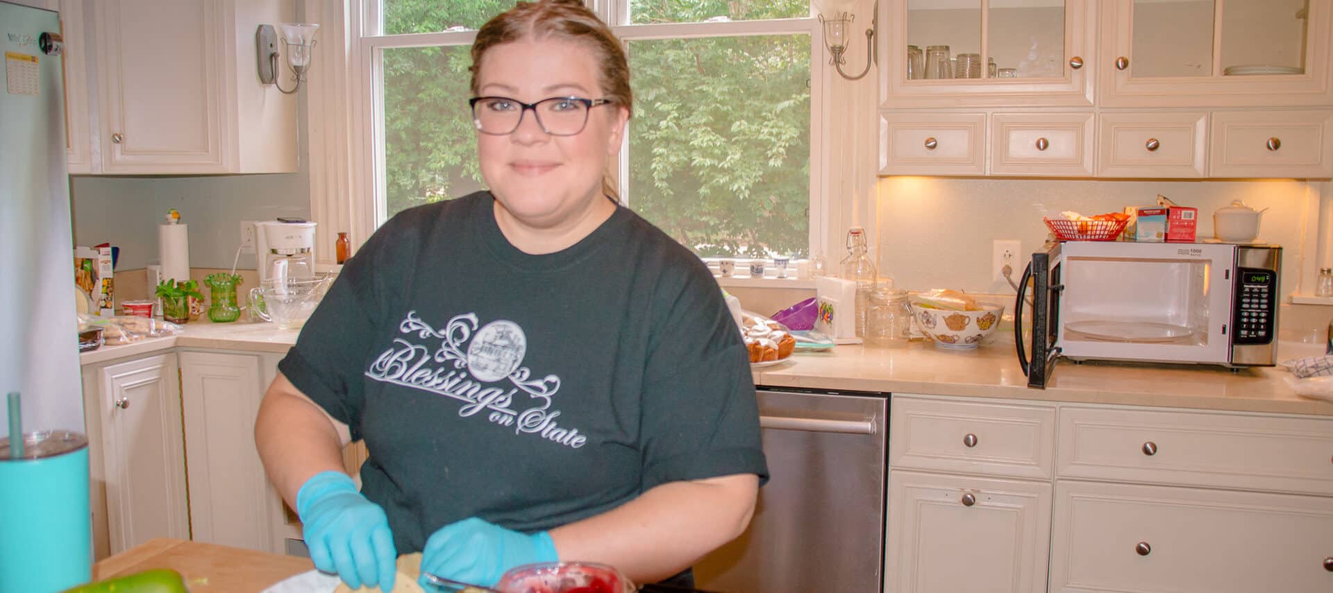 young woman prepares breakfast in kitchen